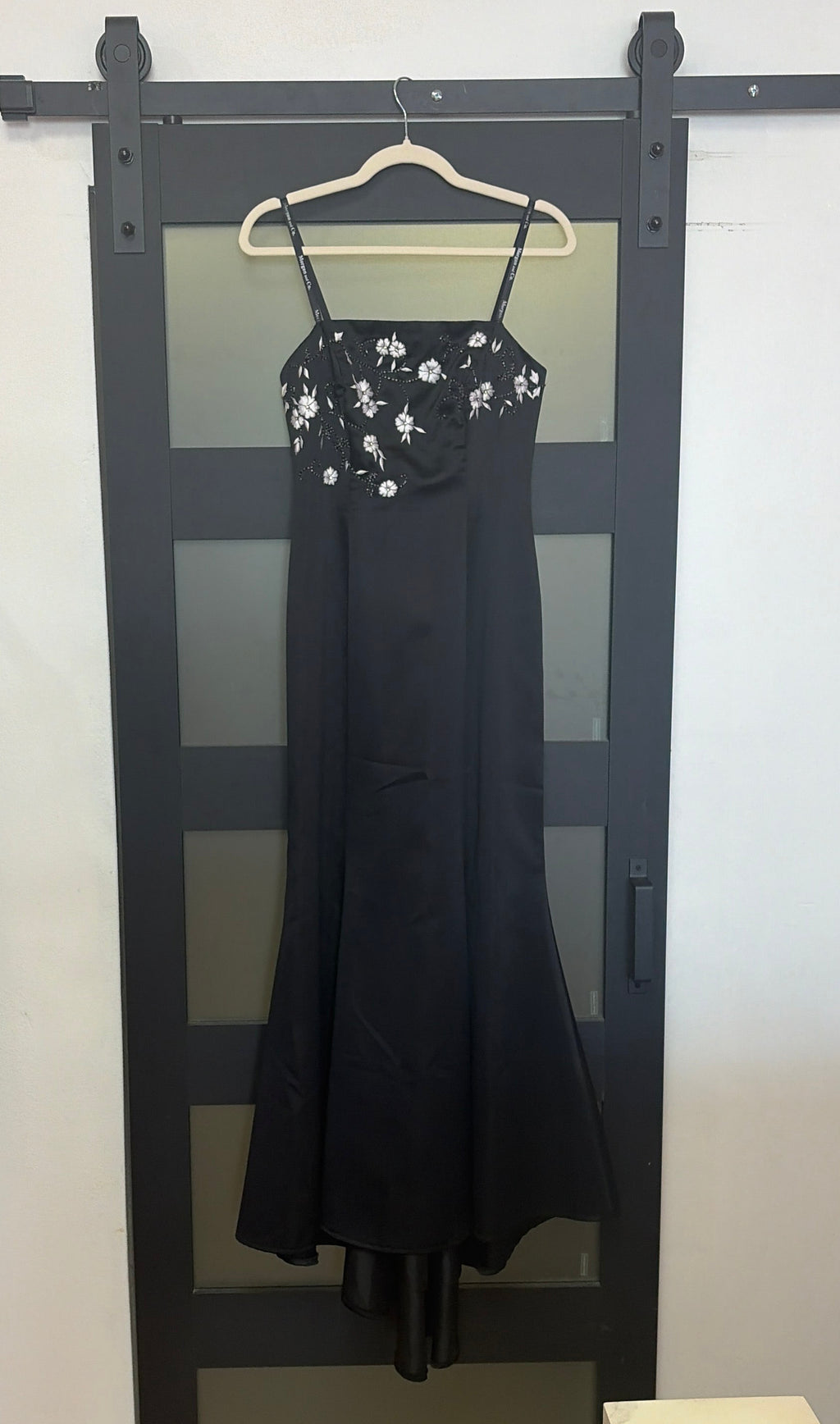 Black floor length evening gown with floral detailing