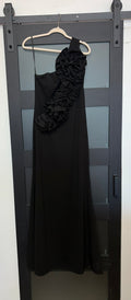 Betsy & Adam black one shoulder gown with floral detail across chest