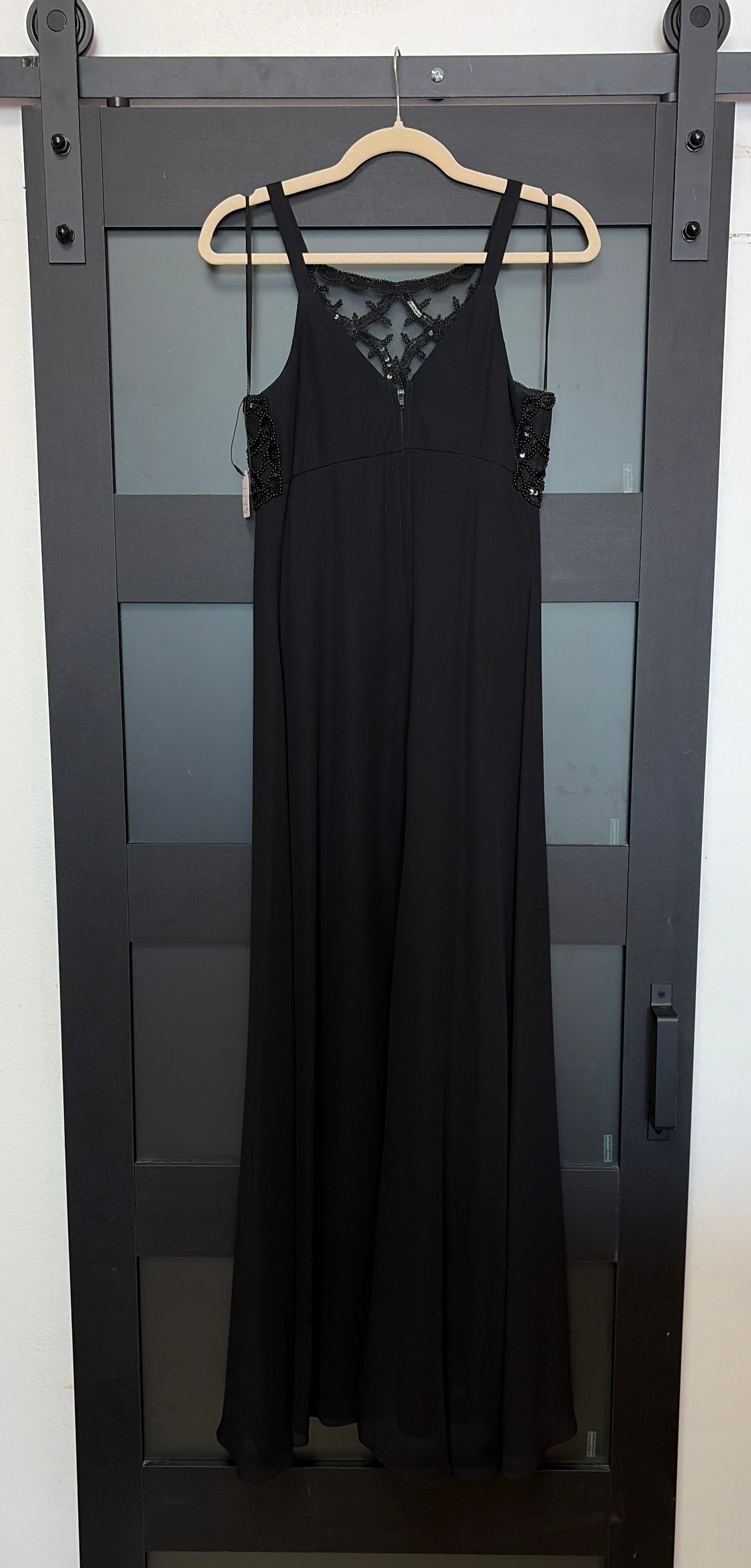 Black flowy Faviana gown with beaded bust detailing