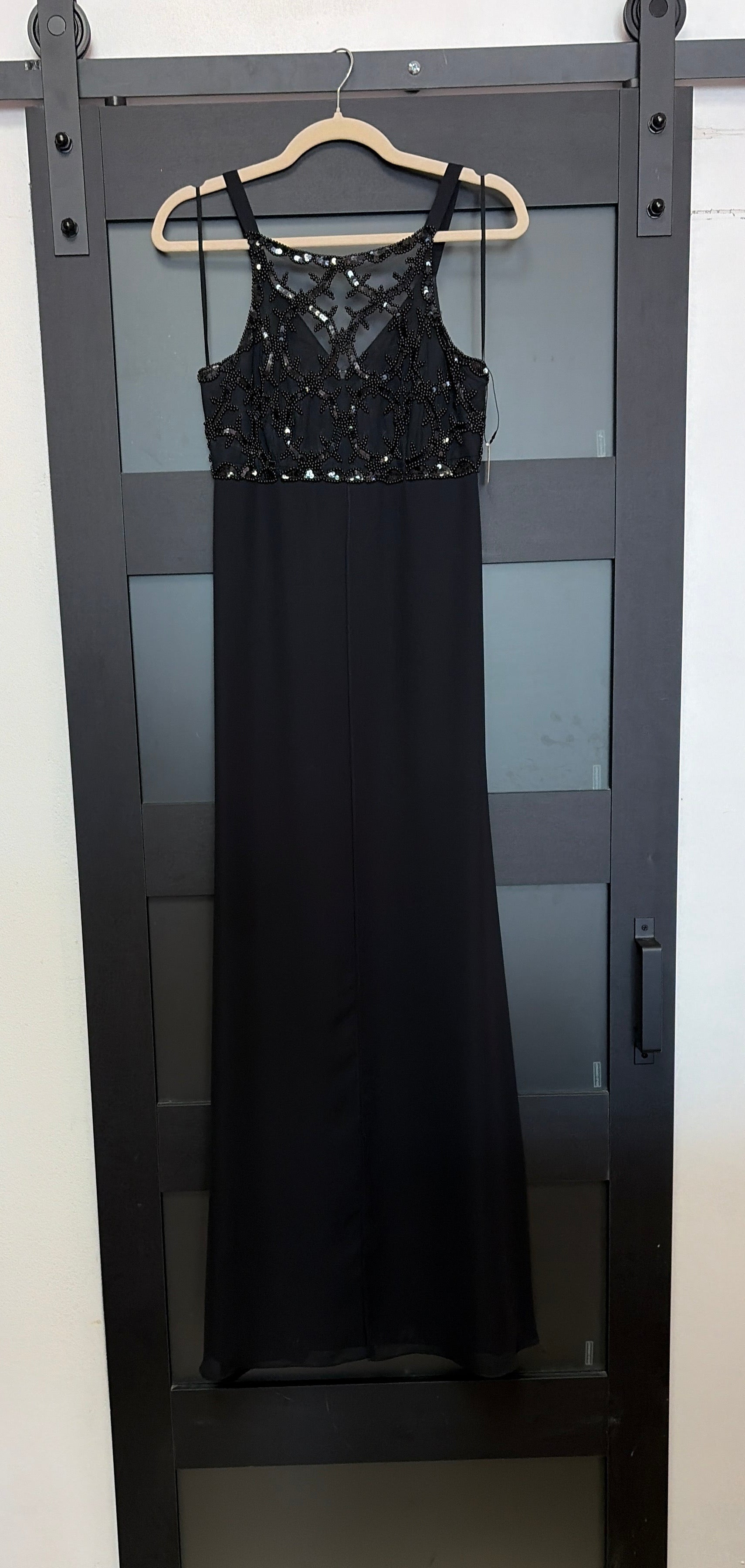 Black flowy Faviana gown with beaded bust detailing
