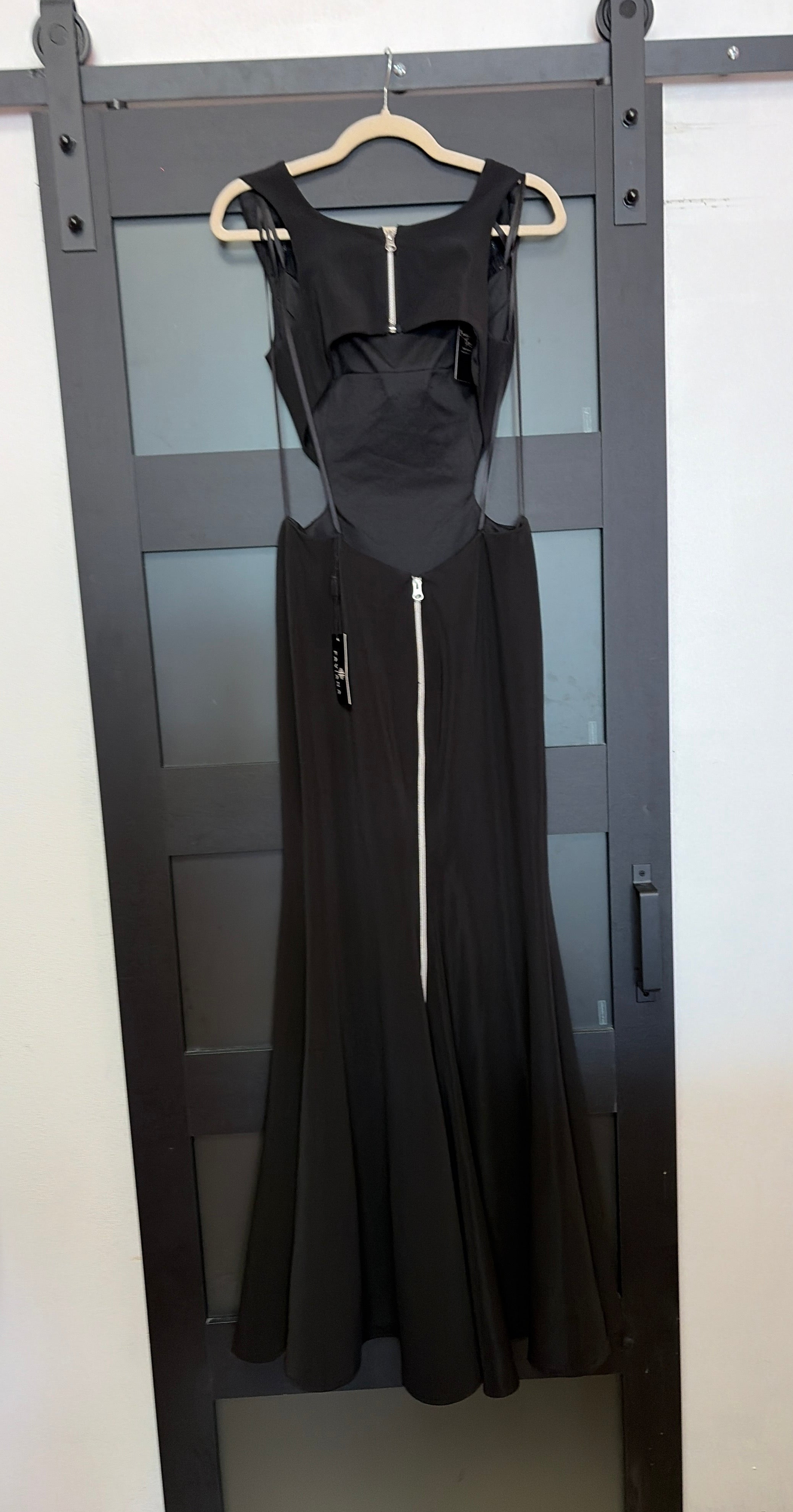Faviana style 7988 black gown with side cutouts, zipper detail down back