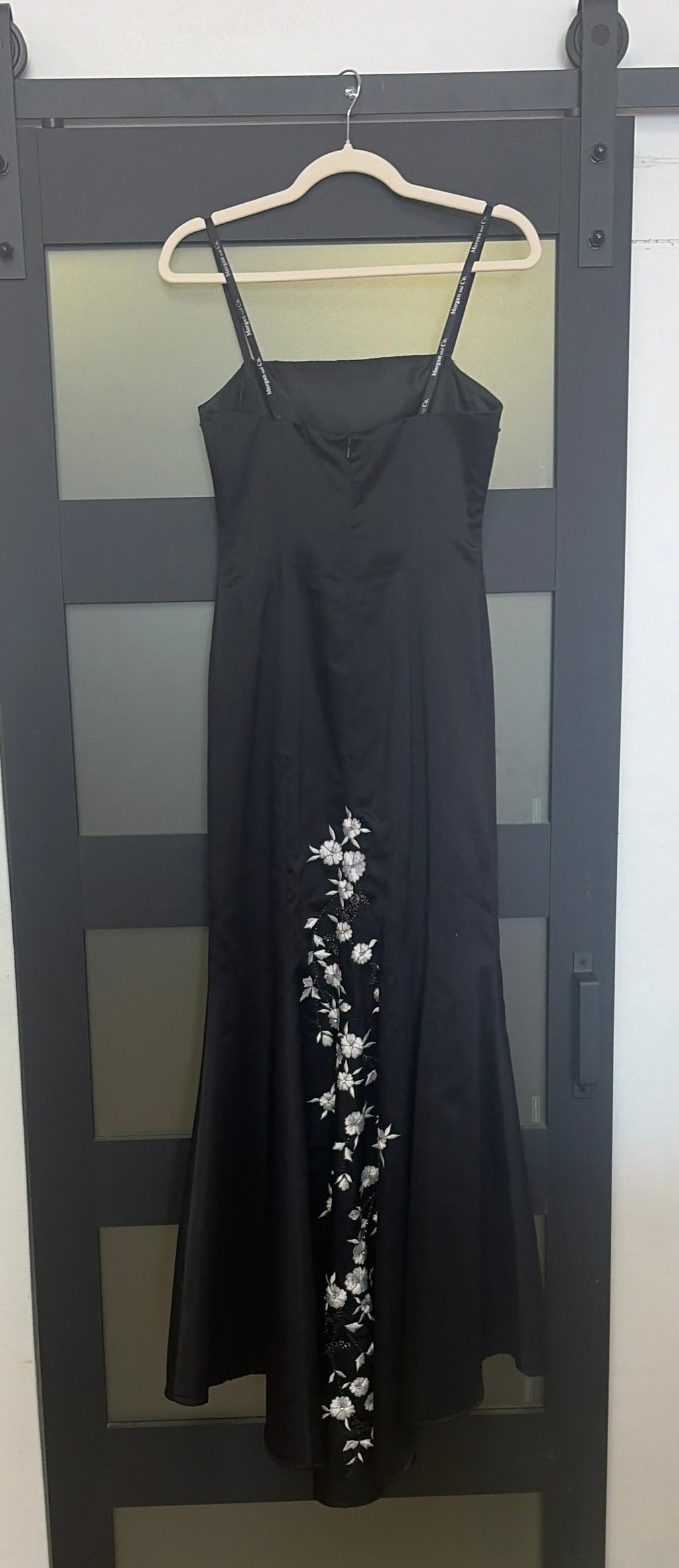 Black floor length evening gown with floral detailing