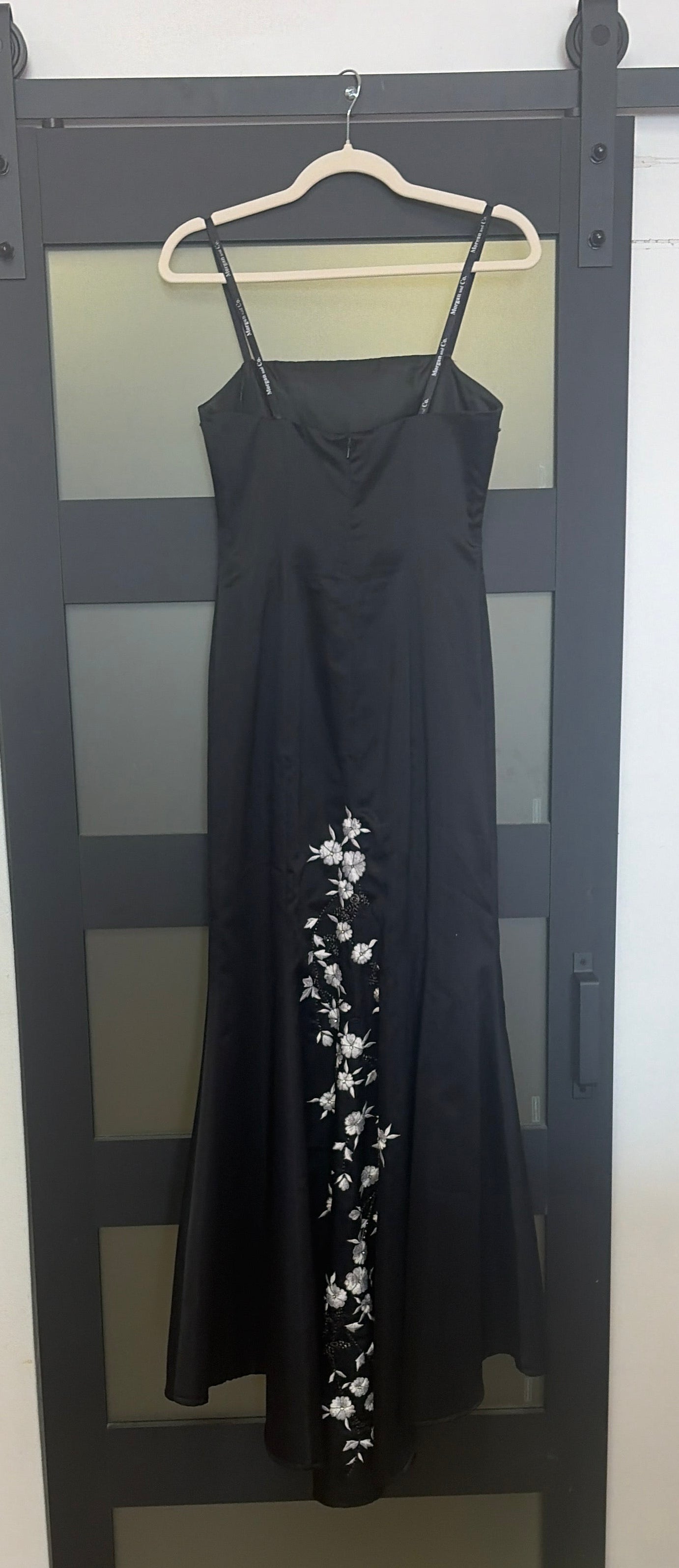 Black floor length evening gown with floral detailing